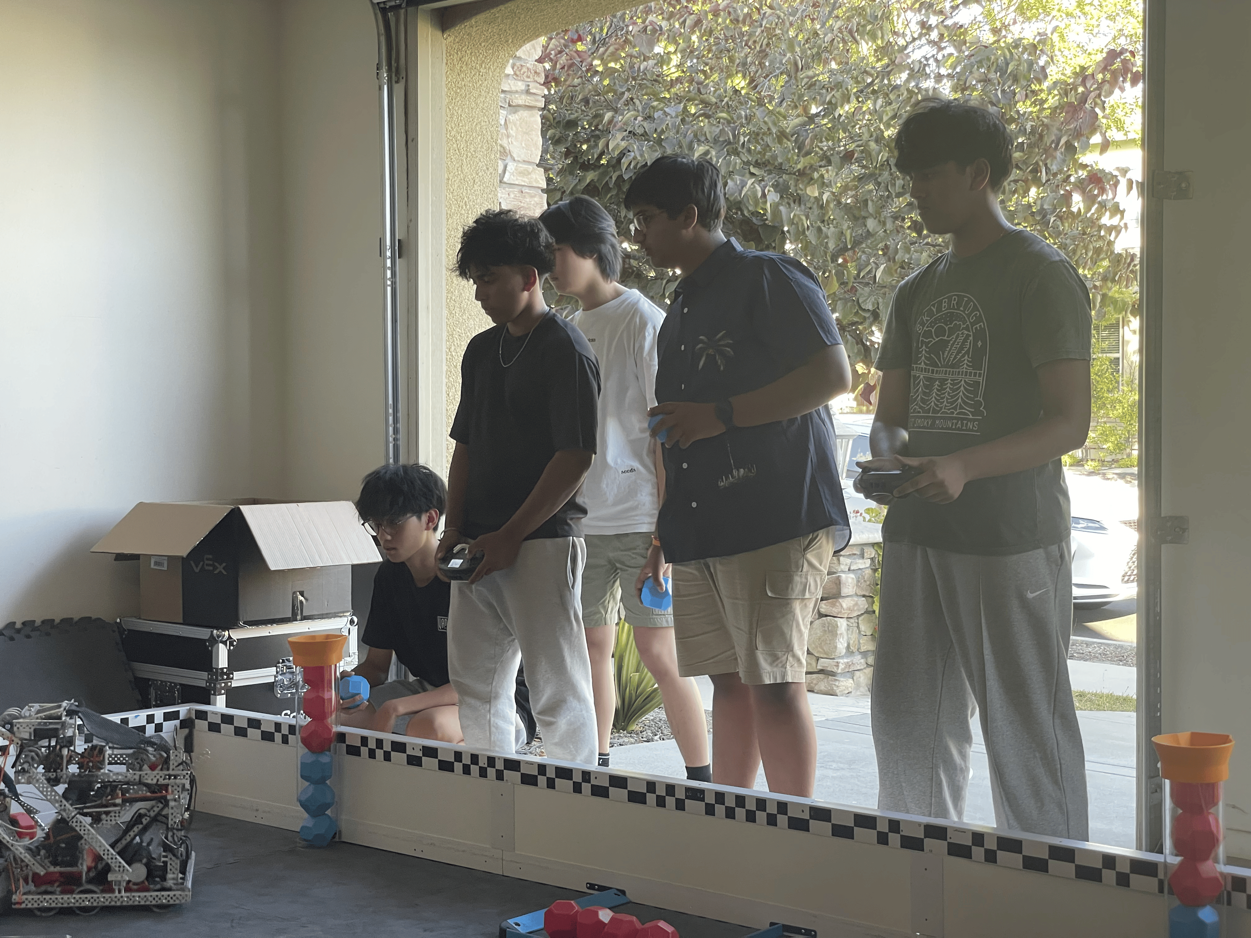 NextGen AI BOTS VEX robotics team members working together on robot projects