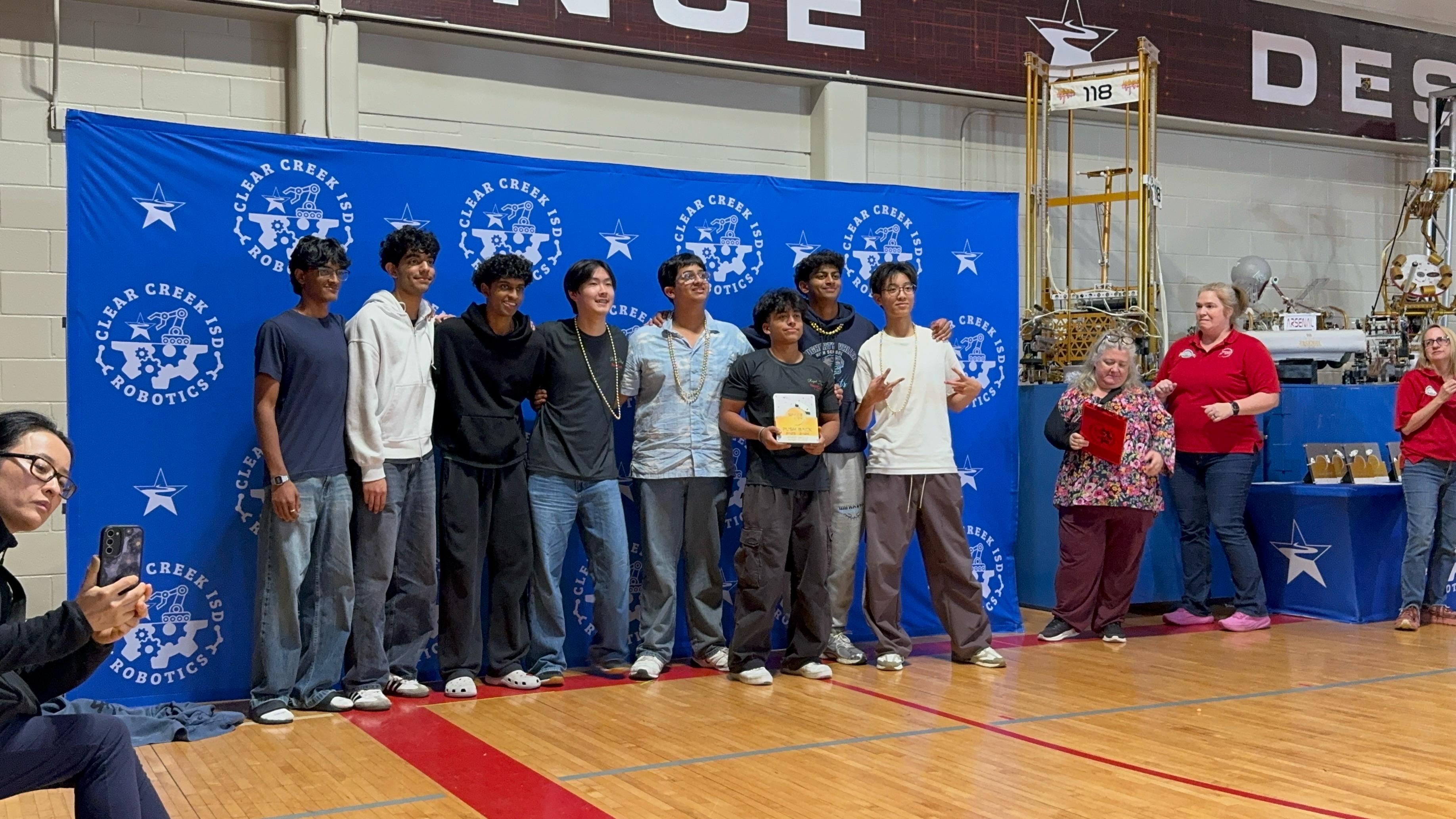 NextGen AI BOTS VEX robotics team members working together on robot projects